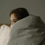 blue light blocking strategy 2026 — amber glasses for melatonin preservation